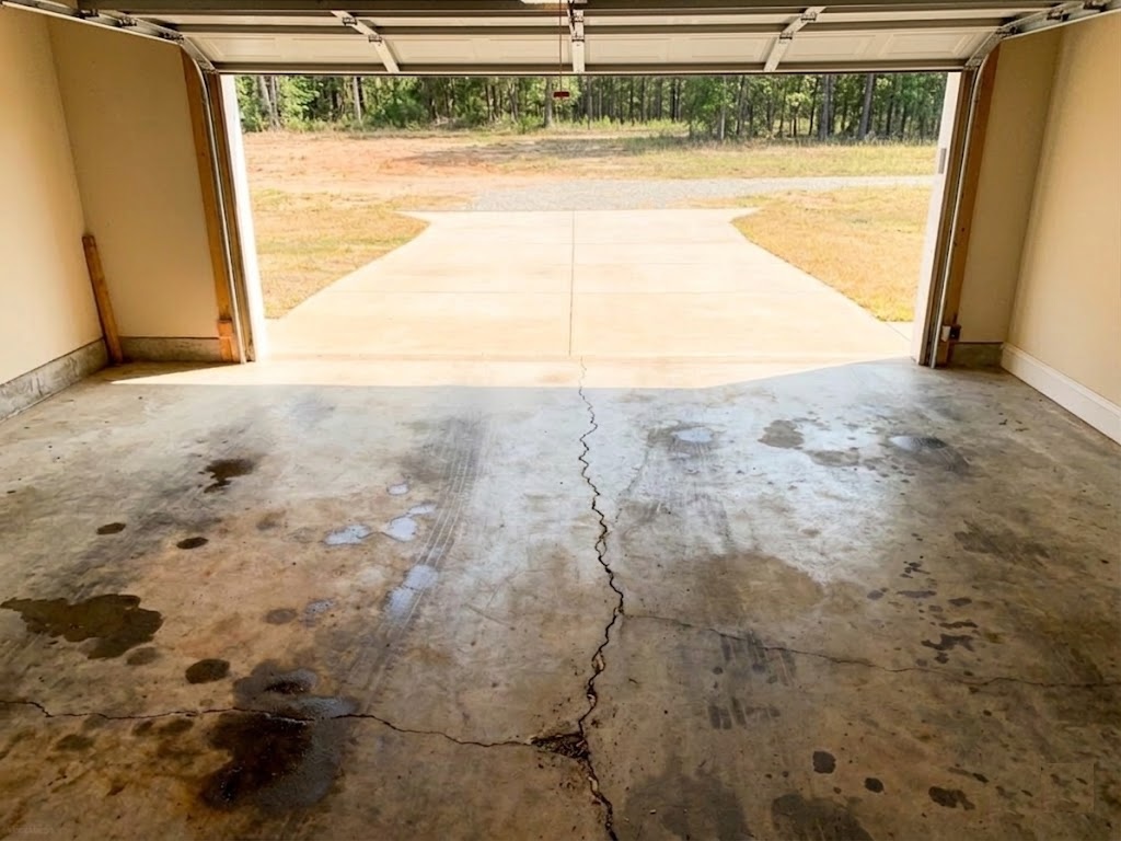 Before — Bare concrete garage floor